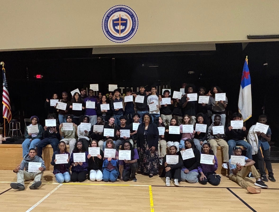 Adventist Christian Academy of Raleigh students holding their LEVELLESS® 101 completion certificates